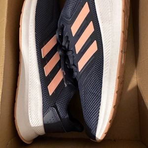 Slightly worn size 11 women’s Adidas run falcon sneakers